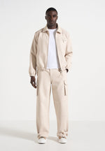 kilian-unisex-twill-signature-jacket-beige