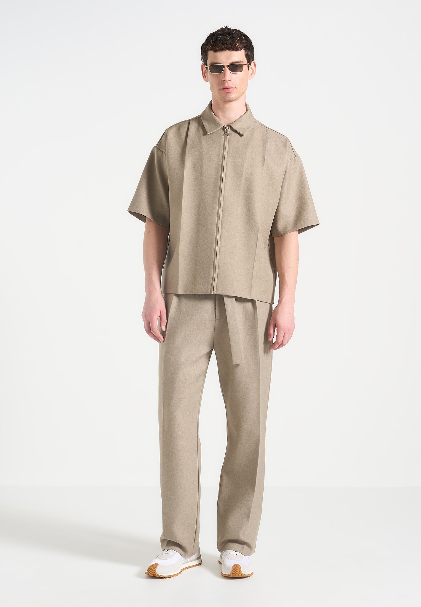 relaxed-fit-textured-belted-tailored-trousers-beige