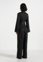 Aurore - Mock Neck Ring Belt Pleated Leg Jumpsuit - Black