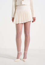 joelle-asymmetric-pleated-mini-skirt-cream