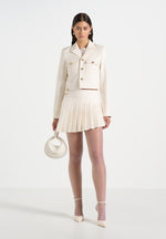 joelle-asymmetric-pleated-mini-skirt-cream