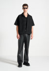relaxed-fit-vegan-leather-pleated-trouser-black