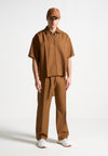 relaxed-fit-textured-belted-tailored-trousers-fawn